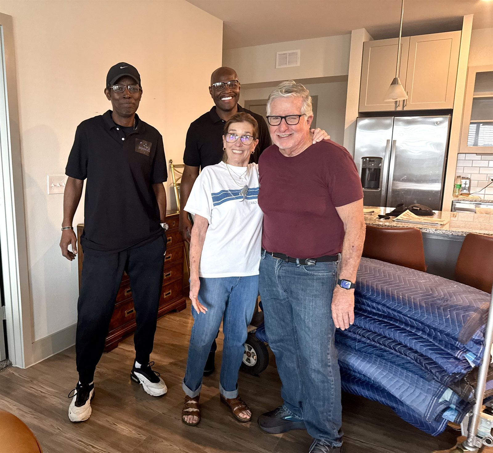 Greg and the SilverBack crew with smiling customers in their new home